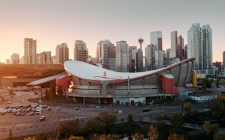 an aerial view of a stadium with a city in the background