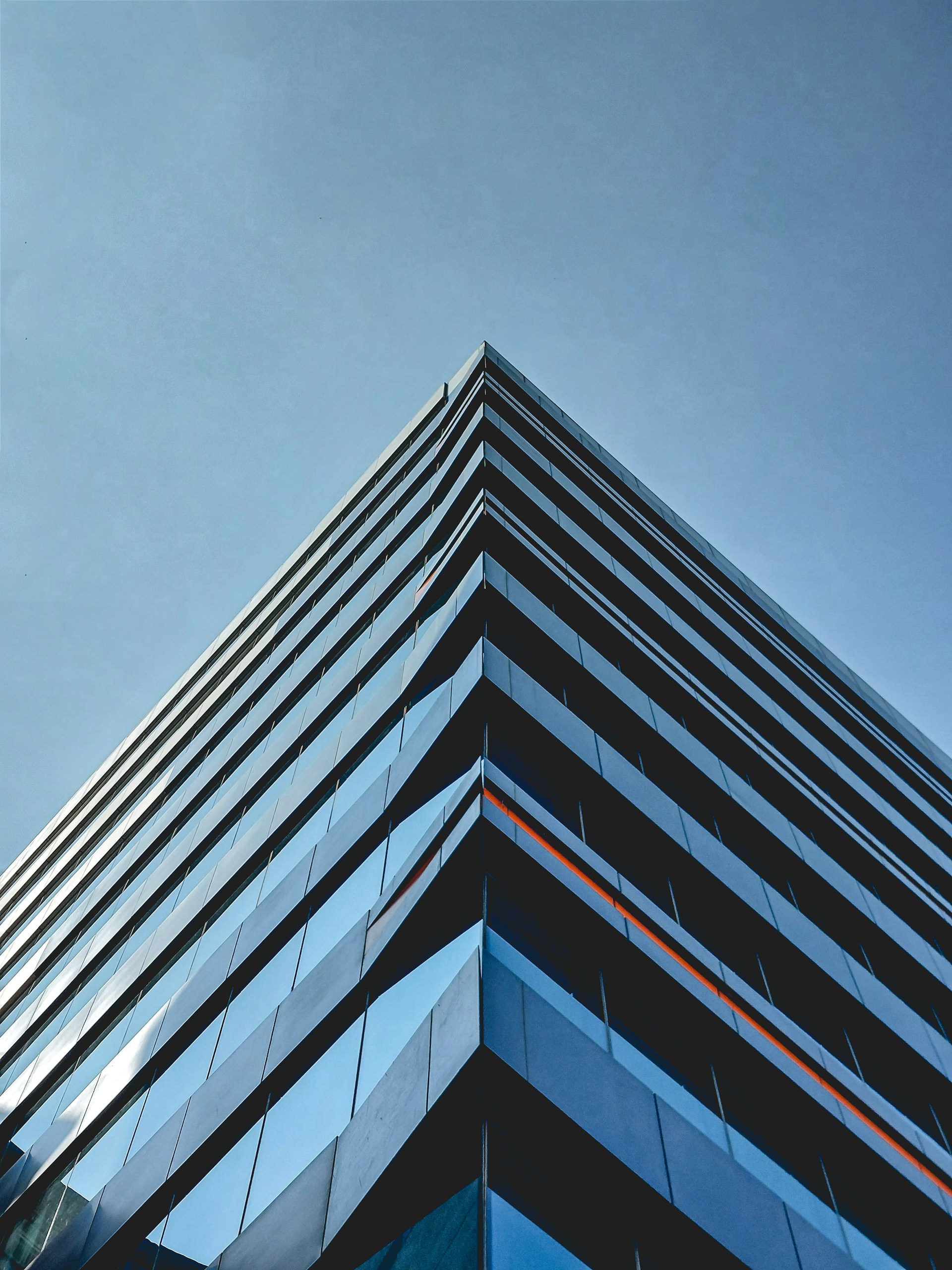 a tall building with a sky background