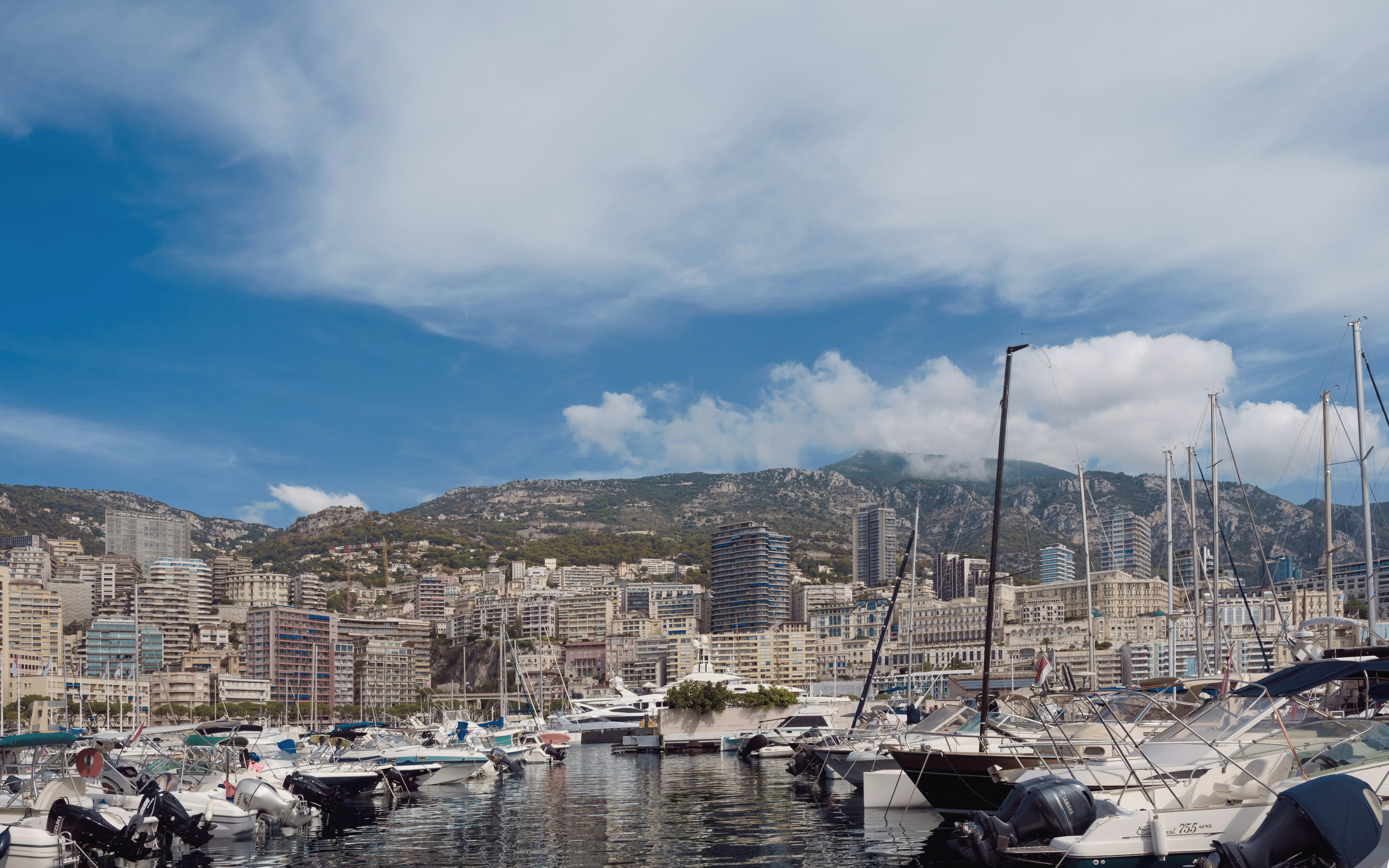 a harbor filled with lots of boats under a cloudy blue sky, 2023, September – Walking the streets of Monaco