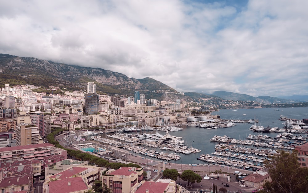 a harbor filled with lots of boats under a cloudy sky