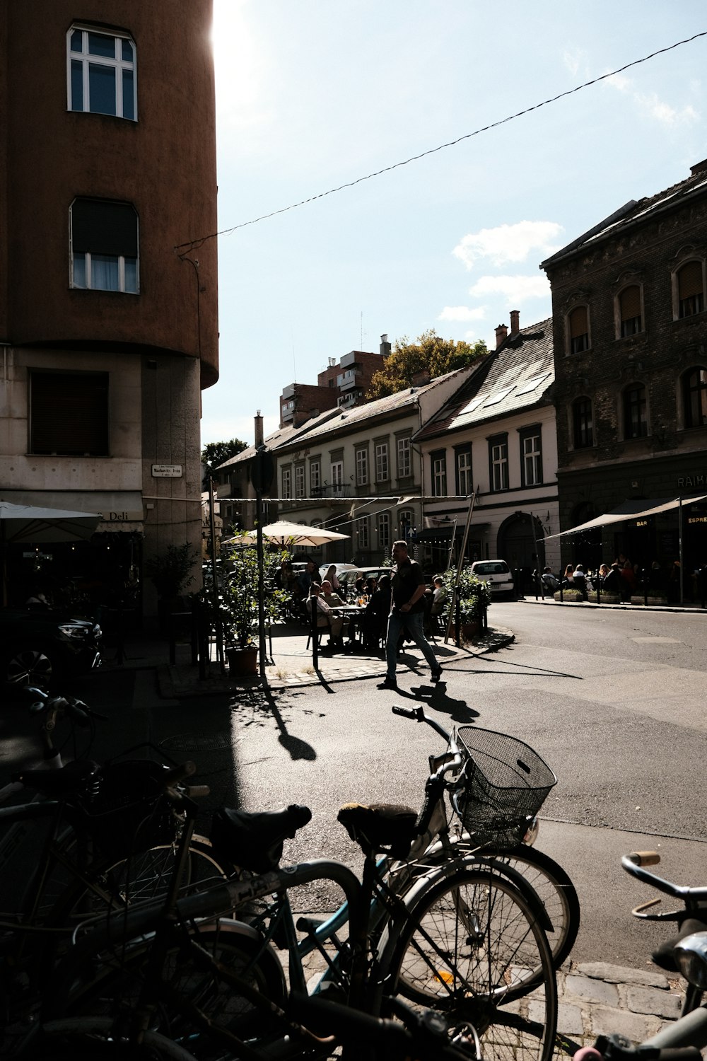 a couple of bikes parked next to each other on a street