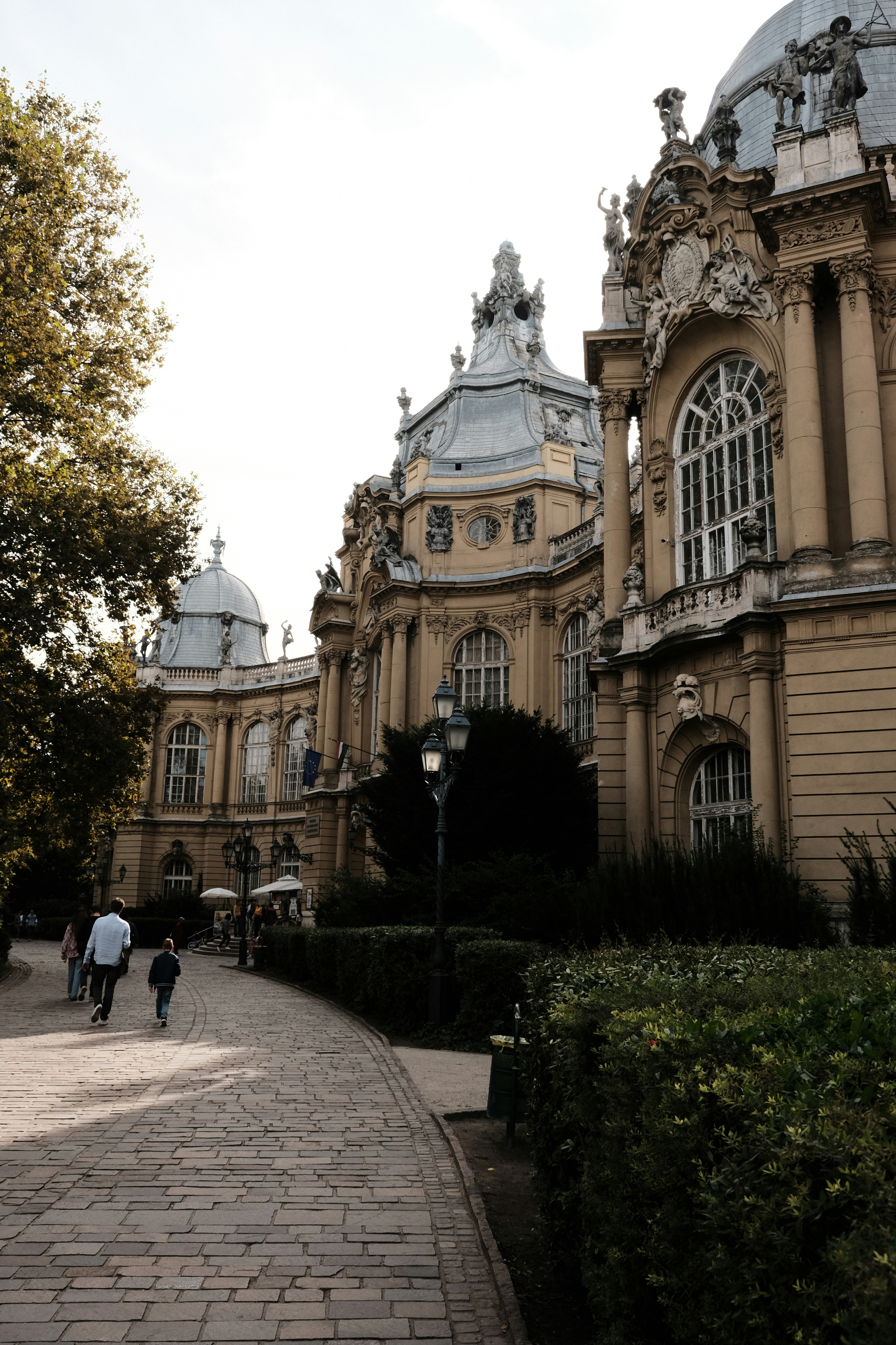 A large building with a clock tower on top of it photo – Free Wallpaper ...