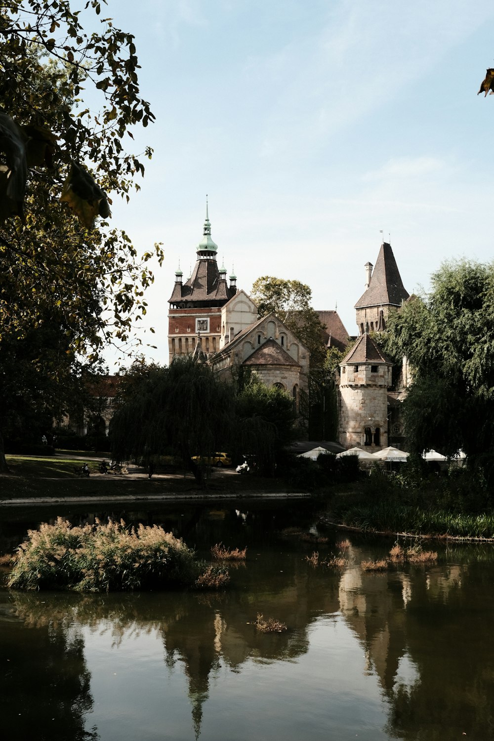 a castle with a pond in front of it