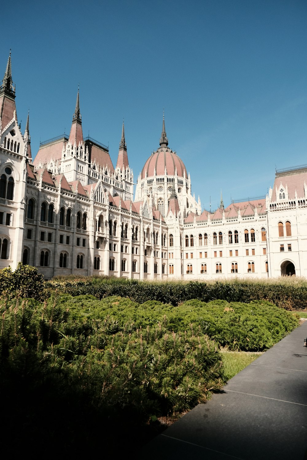 a large white building with many windows and towers