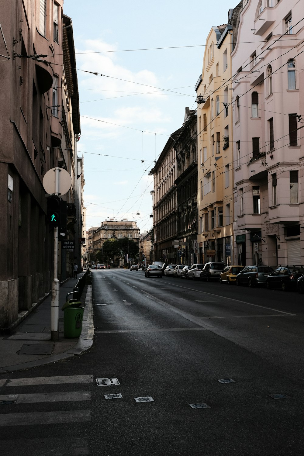 a street with cars parked on both sides of it