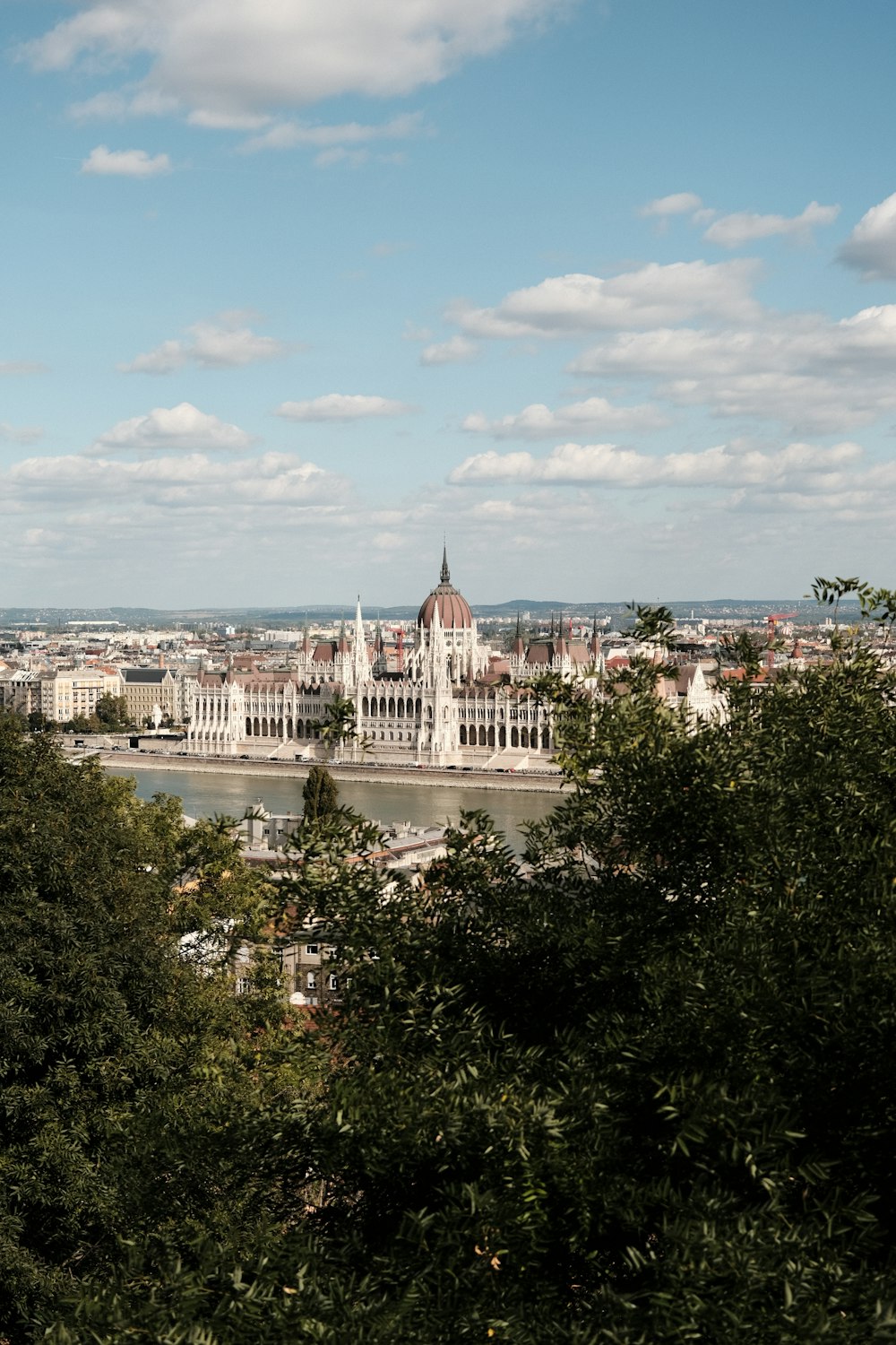 a view of a city from the top of a hill