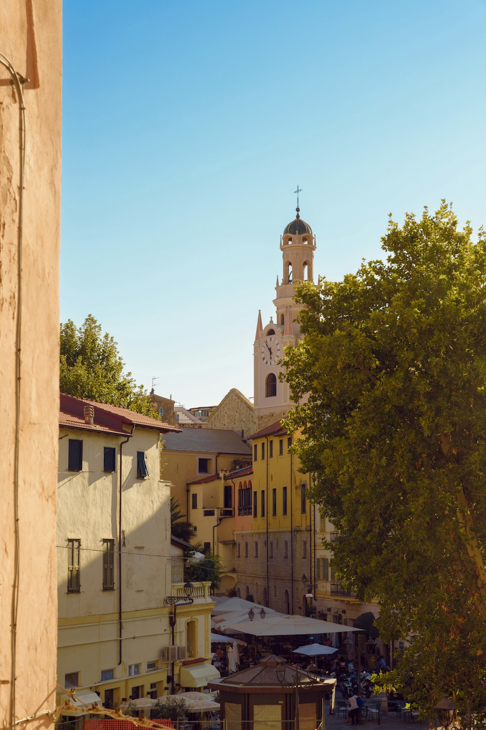 a clock tower towering over a small town