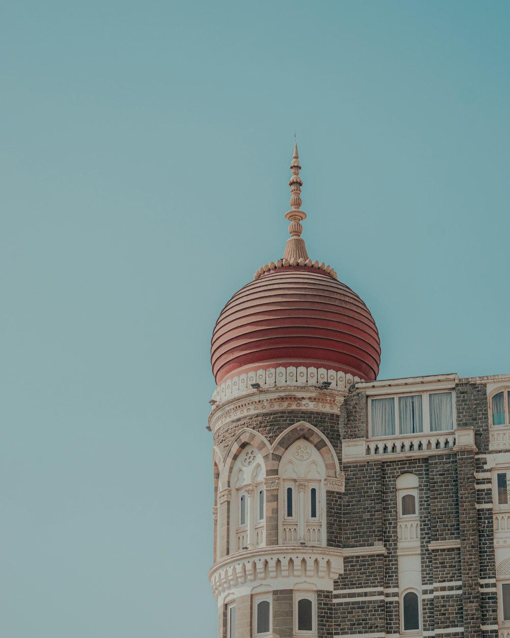 a large building with a red dome on top