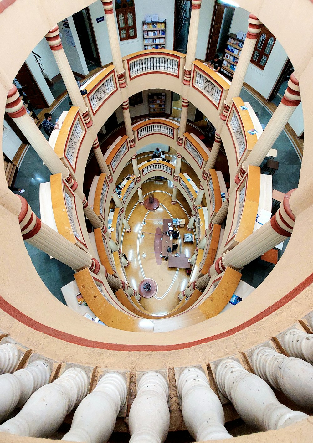a view of a building from the top of a spiral staircase