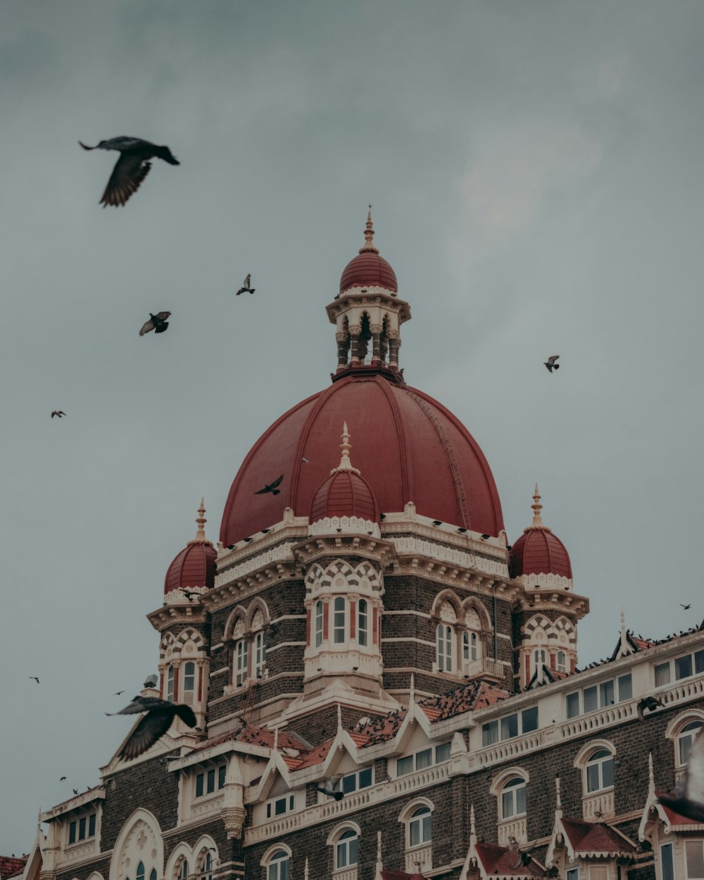 a large building with a red dome on top of it