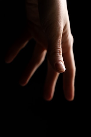 a close up of a person's hand holding something