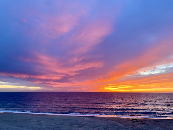 A stunning sunset over a serene beach.
