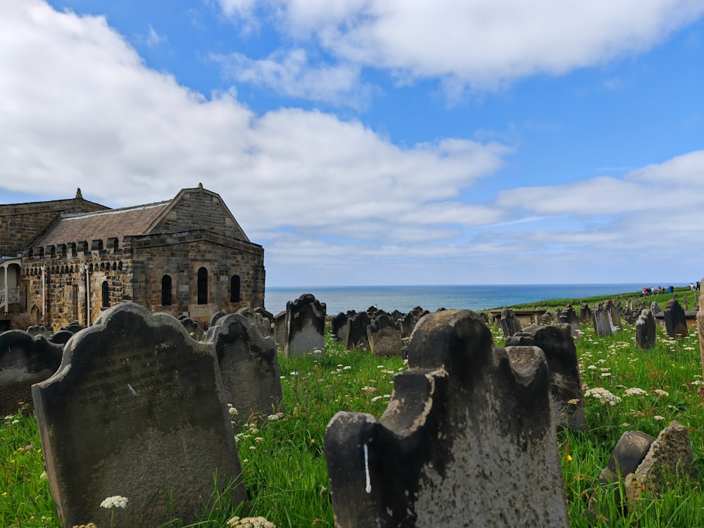 a graveyard with a church in the background