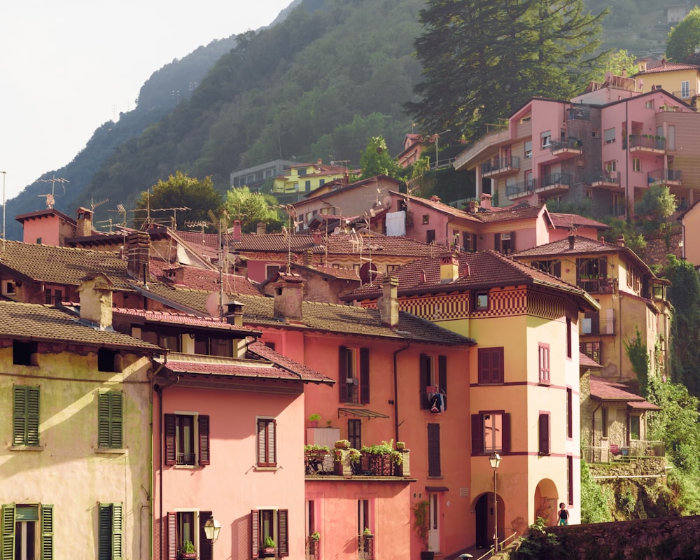 a group of buildings with a mountain in the background