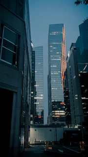 Evening cityscape through a large office window, reflecting aralety’s forward-thinking vibe