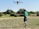 A satisfied farmer standing in a field with a drone.