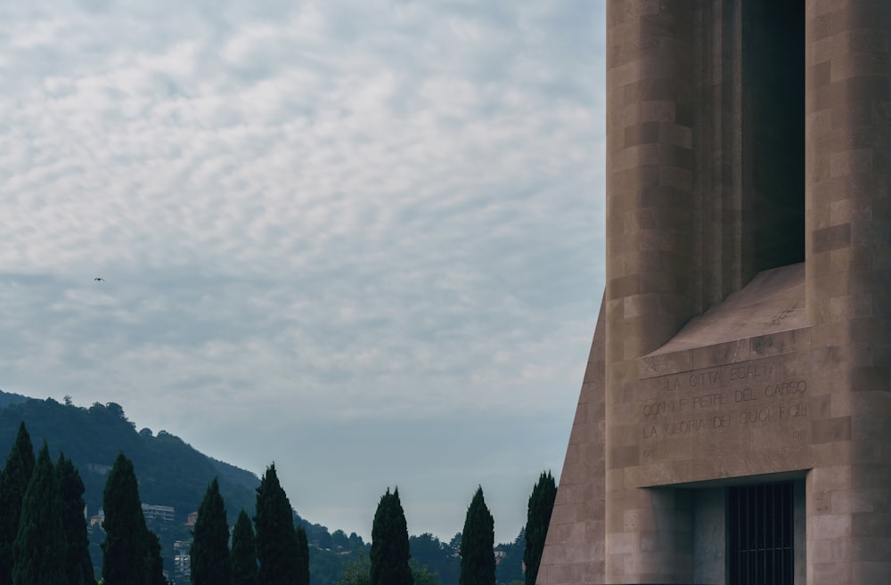 a tall building with a clock on the side of it