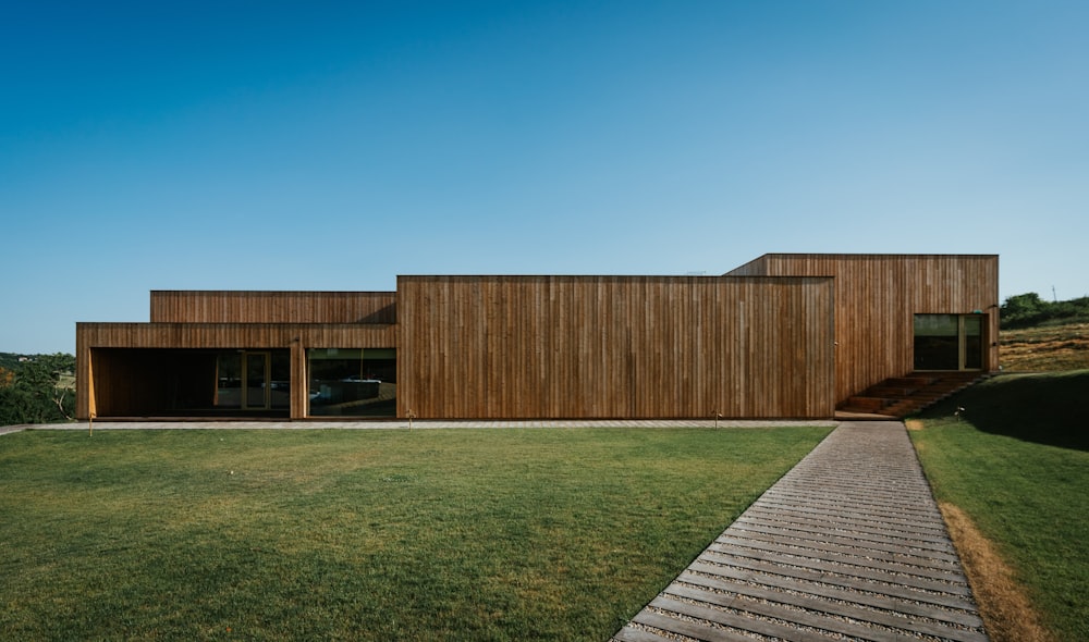 a wooden house with a walkway leading to it