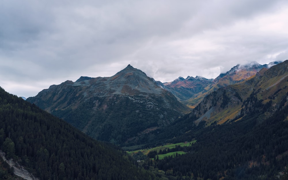 a view of a valley with mountains in the background