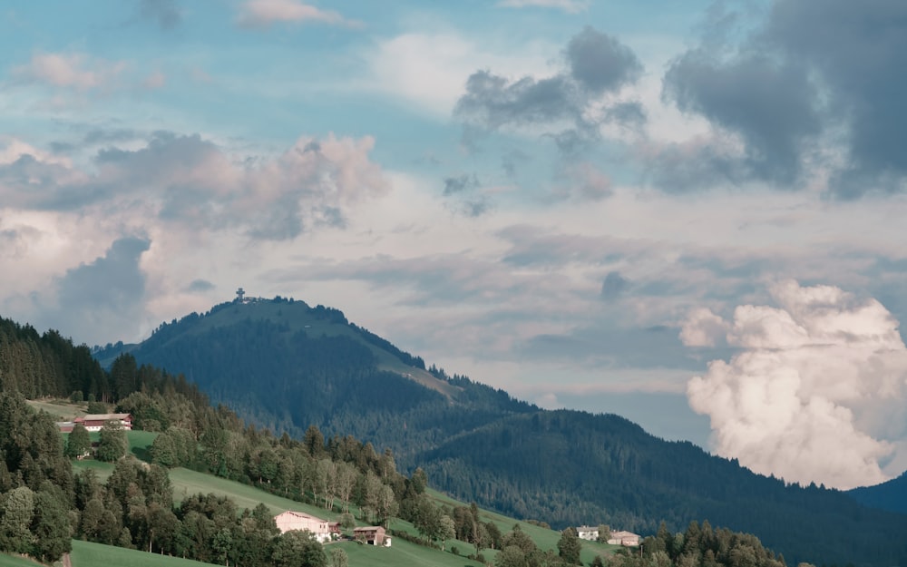 a view of a mountain range with houses on it