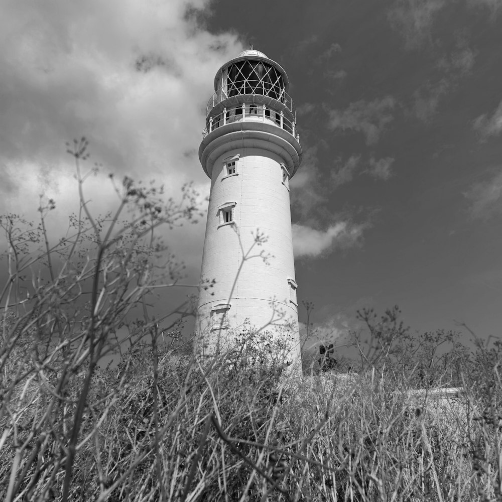 a black and white photo of a lighthouse