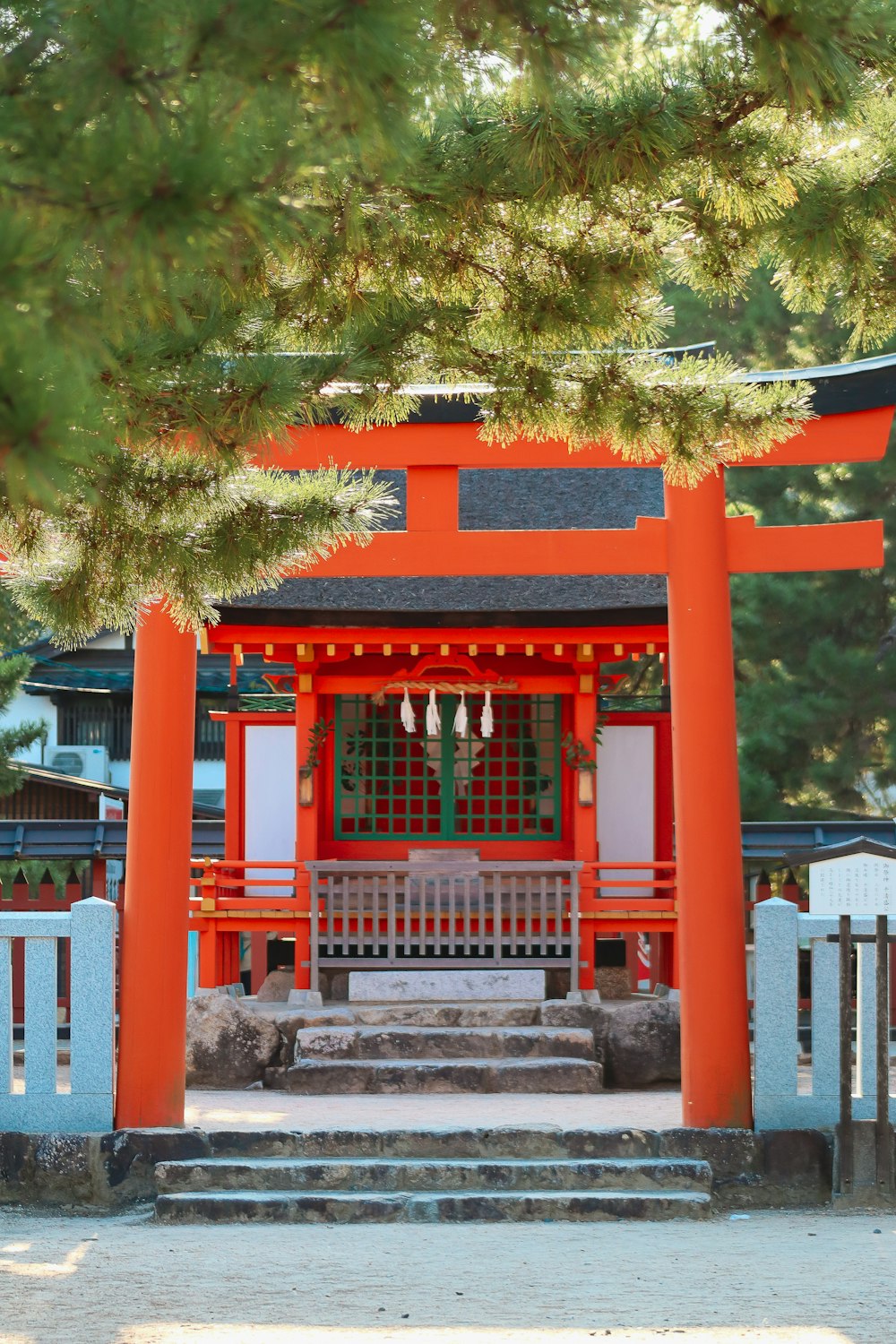 a red building with a white fence around it