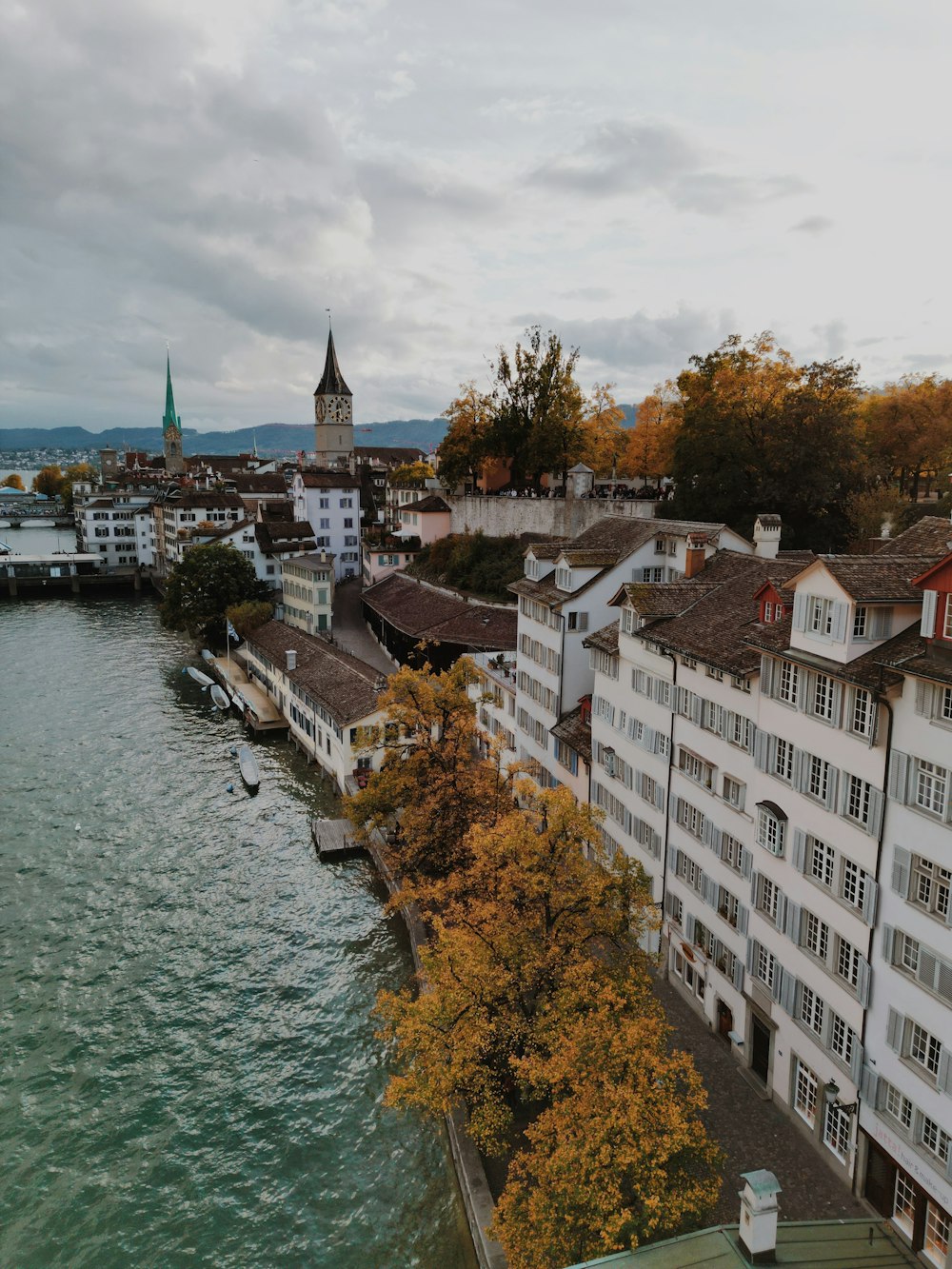 a river running through a city next to tall buildings