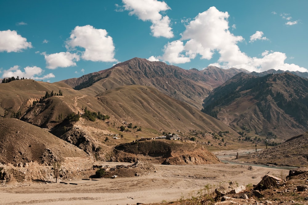 a dirt road in the middle of a mountain range