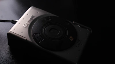 A sleek, moody frame from a luxury brand film shoot featuring cinematic lighting and a refined setting.