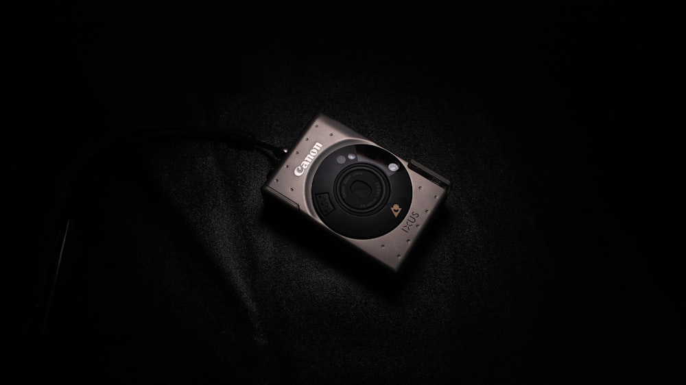 a camera sitting on top of a black cloth