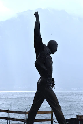 Athlete silhouette framed by the orange soft light of dawn and towering Andes peaks, embodying mental mastery