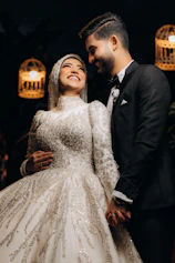 A joyful bride and groom sharing a candid laugh during their wedding ceremony