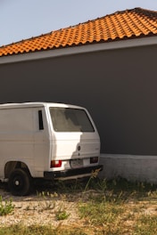 A clean, white wheelchair-accessible van parked outside a medical facility.