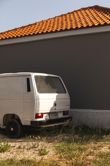 A Gabro B.V. delivery van parked in front of a local business on a sunny day.