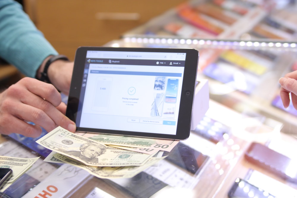 a person holding a tablet in their hands