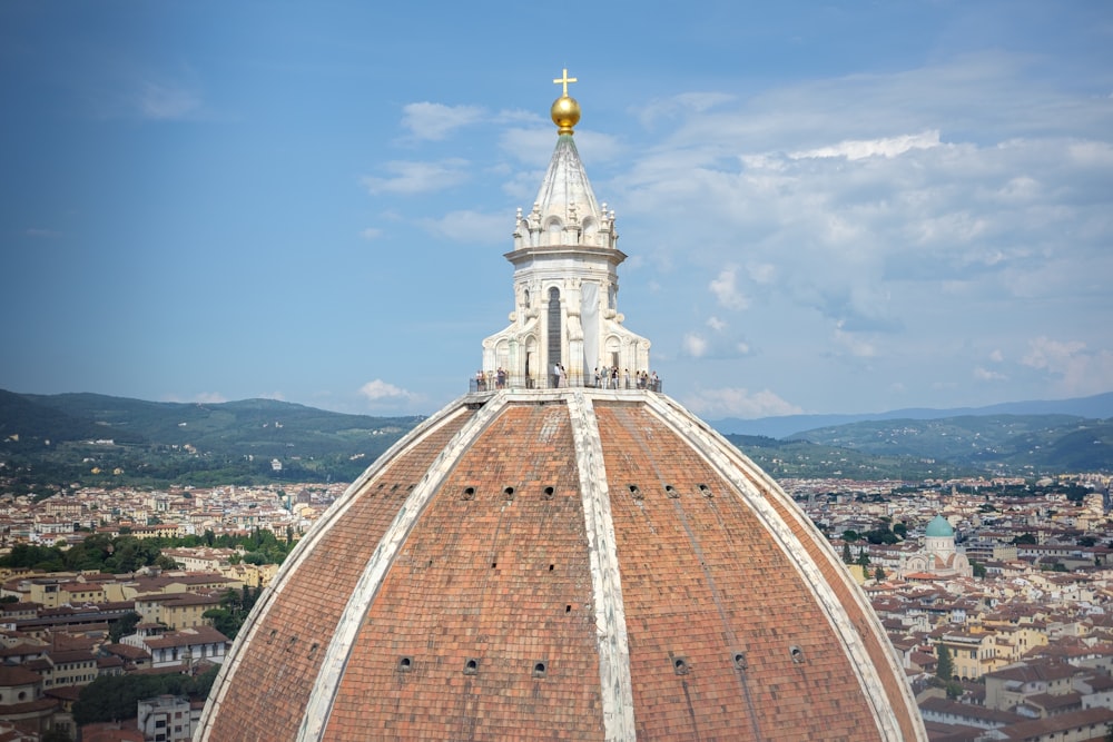 a large dome with a cross on top of it