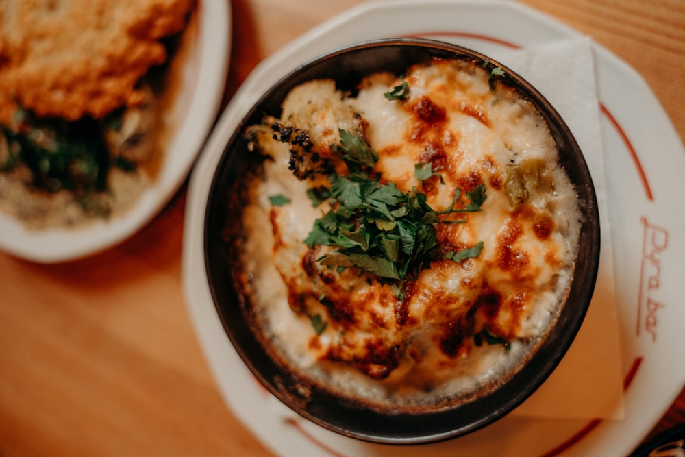 a close up of a bowl of food on a table