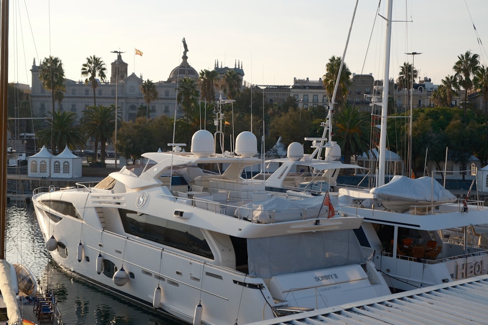 a large white boat docked at a marina