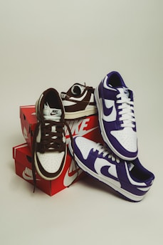 a pair of sneakers sitting on top of a box