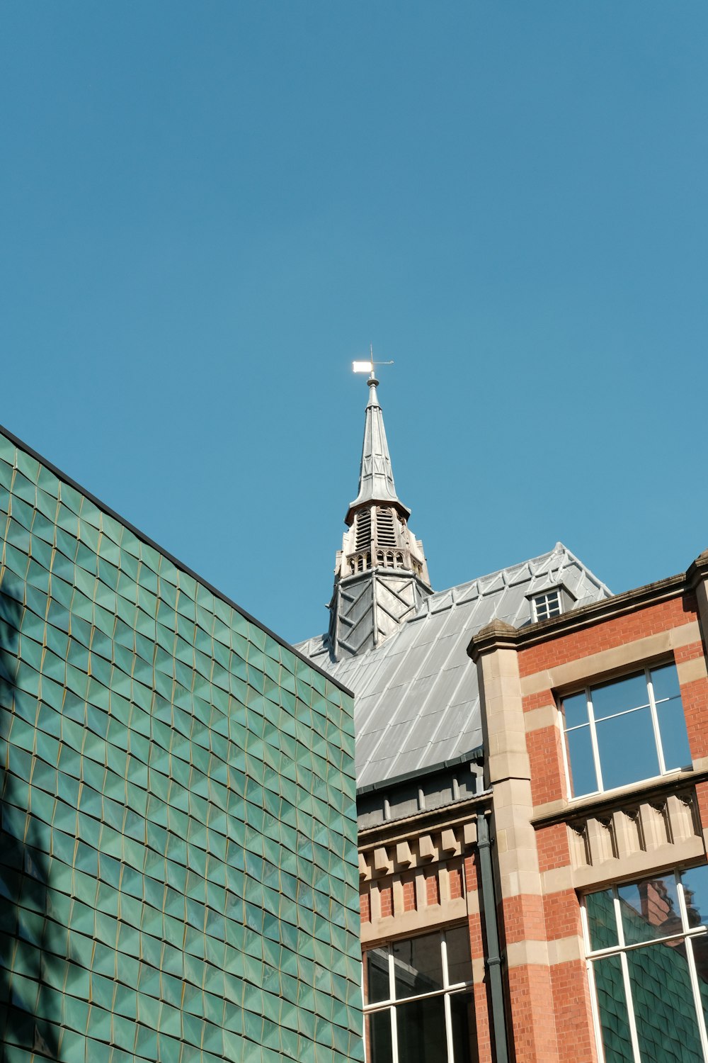 a tall building with a steeple on top of it