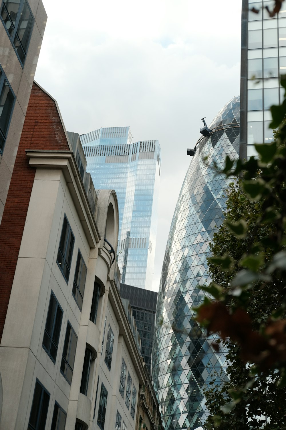 a couple of tall buildings sitting next to each other