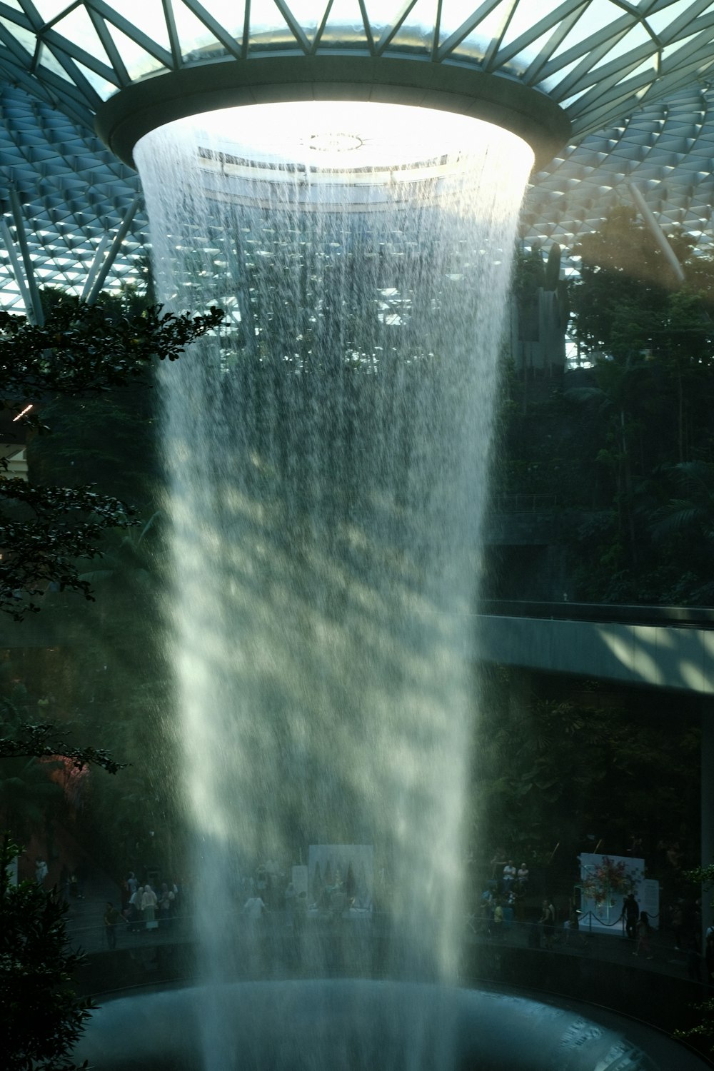 a large waterfall of water in the middle of a building