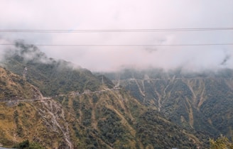 a view of a mountain with a road going through it