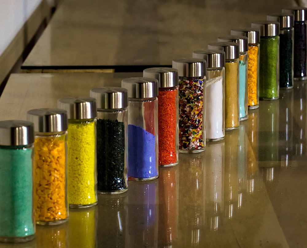 a row of salt and pepper shakers on a counter