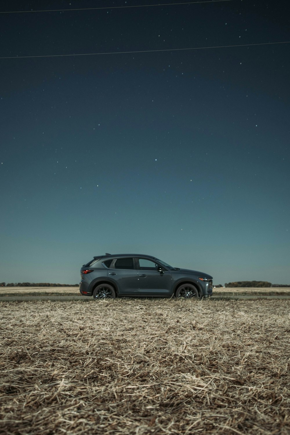 a car is parked in a field at night