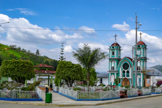 A warm, inviting photo of the Luzmisión chapel filled with smiling families and vibrant ministry activities.