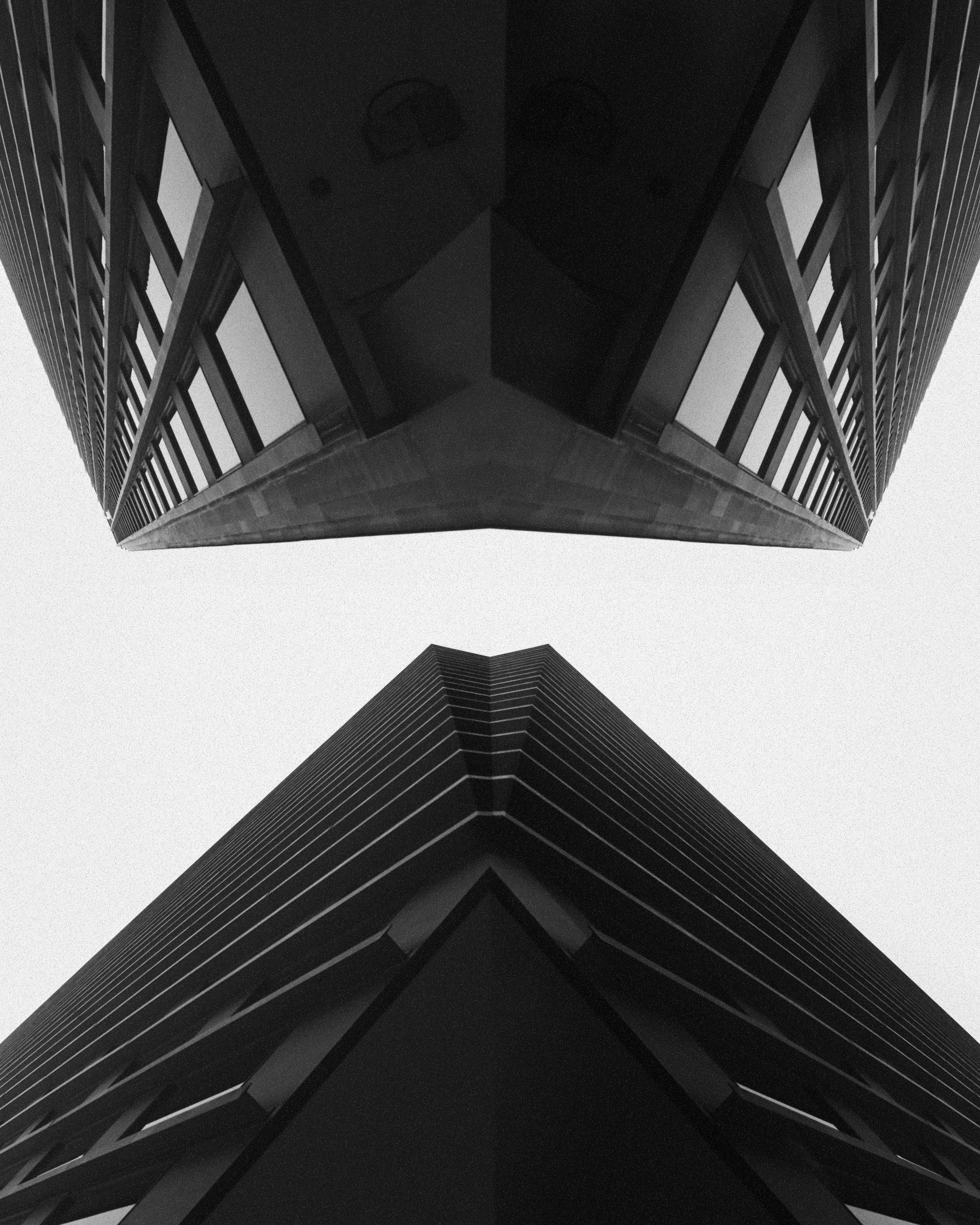 a black and white photo of a very tall building