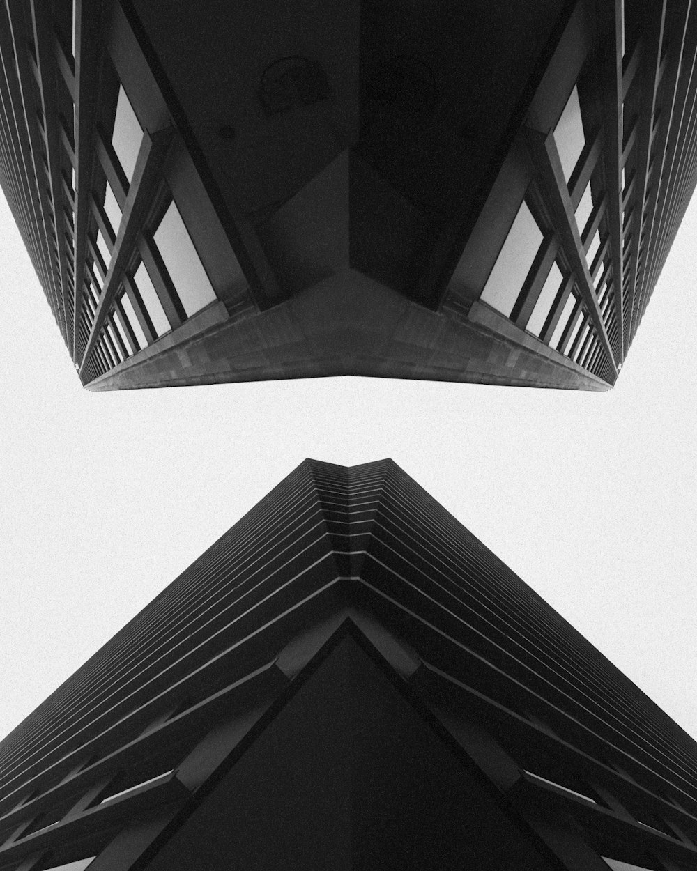 a black and white photo of a very tall building