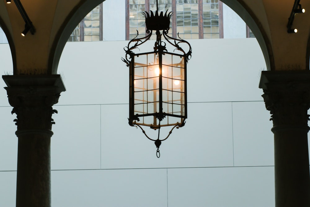 a light hanging from the ceiling of a building