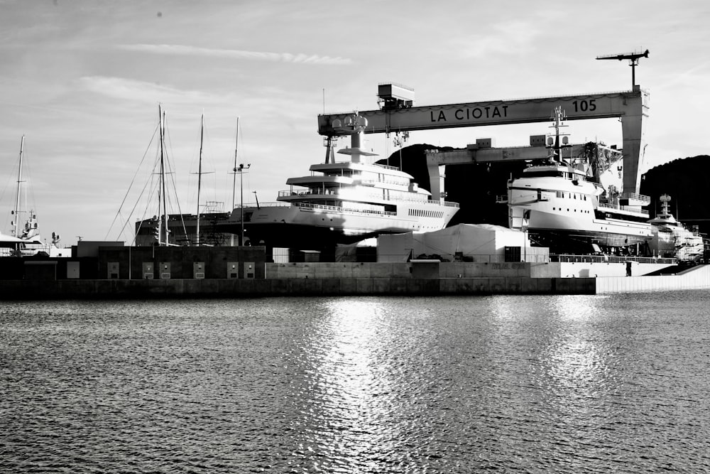 a black and white photo of a boat dock